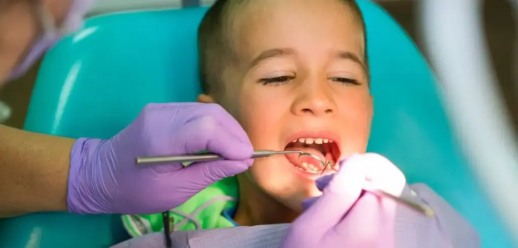 Middle School Boy Getting Teeth Cleaned