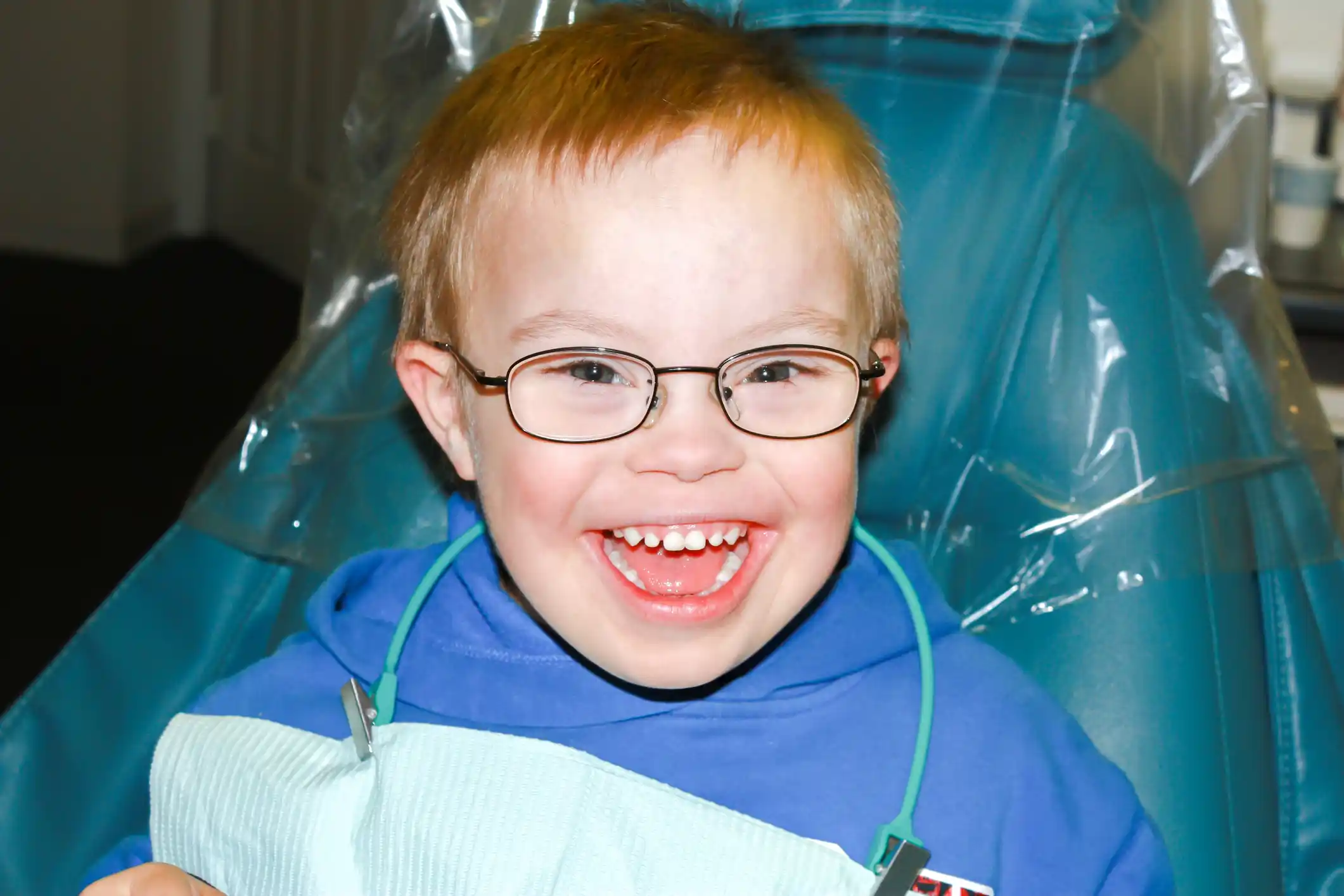 Special needs boy with down syndrome at the dentist